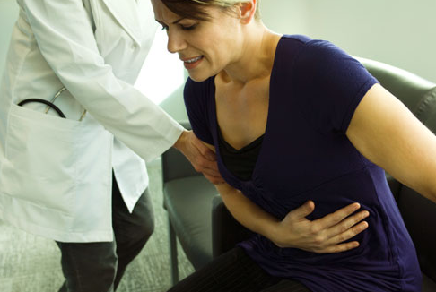 woman with colitis disease pain