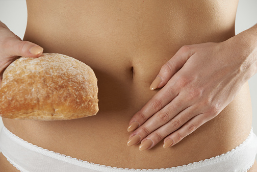 Gluten allergy woman holding bread
