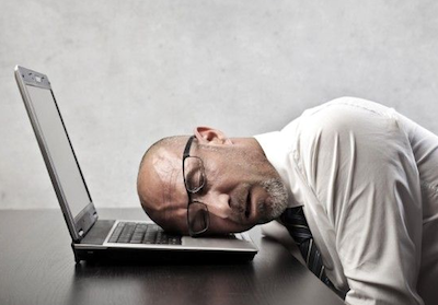 Idiopathic Hypersomnia man sleeping on laptop