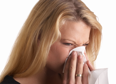 perennial nasal allergy woman blowing nose
