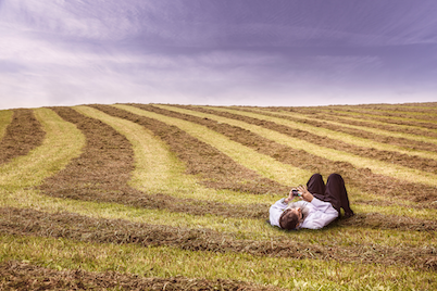 allergy man laying in hay field